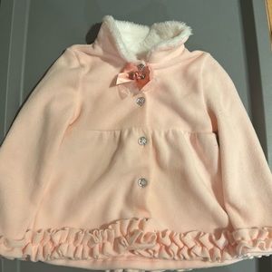 Little Lass pink toddler jacket. With frill and flower details